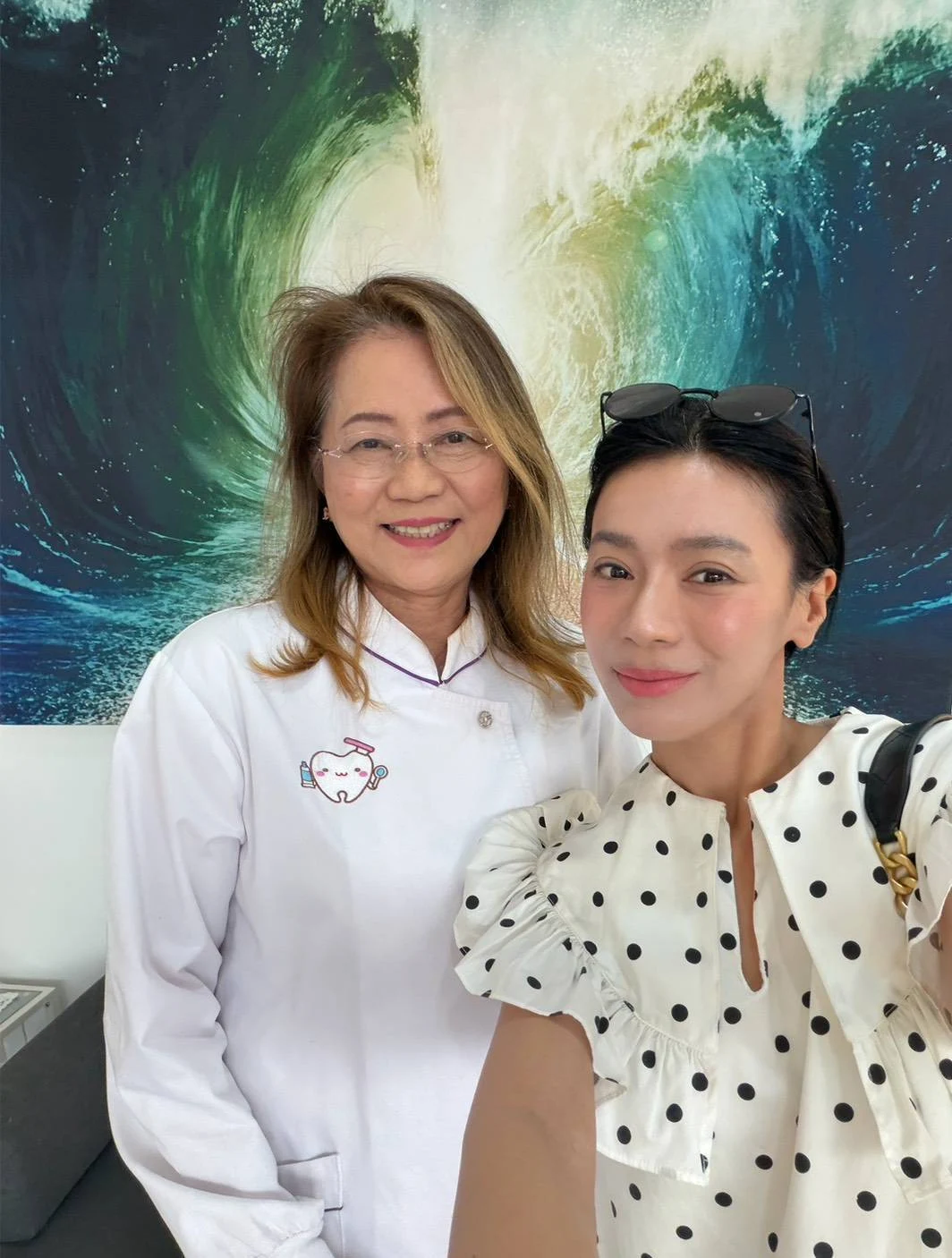 Two people smiling together in the clinic